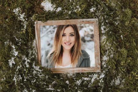 Christmas photo frame with pine branches and snow