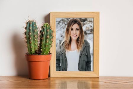 Put your photos into the frame on the table